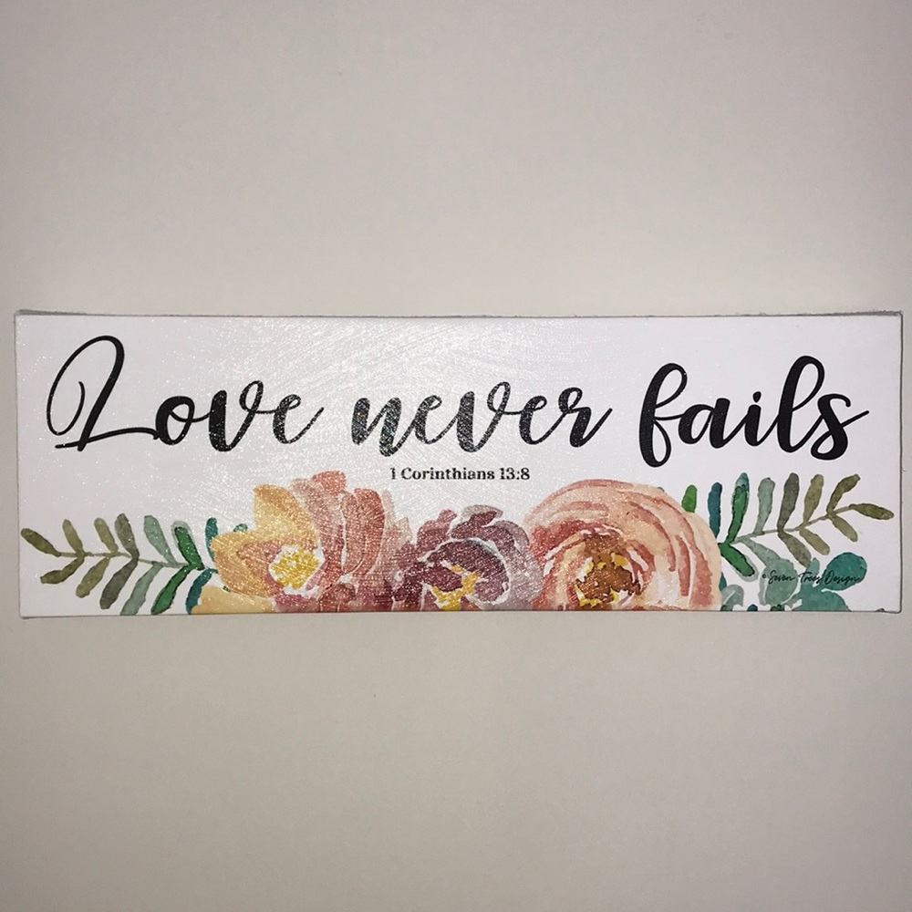 Love never fails canvas wall print